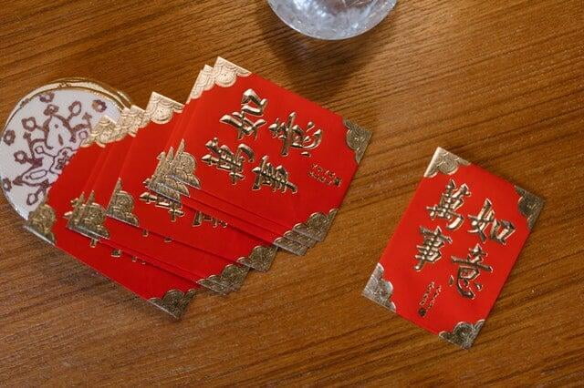 Chinese Red Packets of Lucky Money on Table