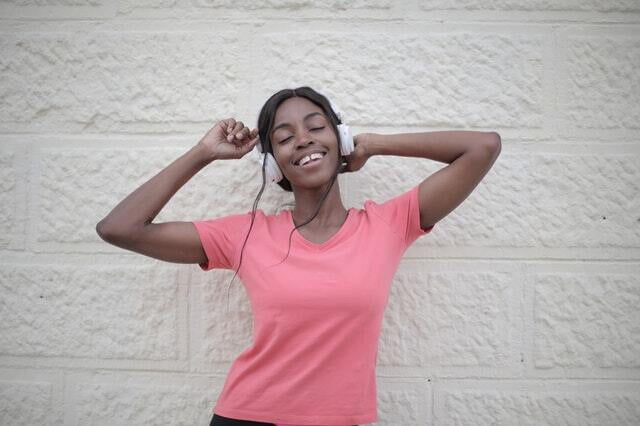 Black woman listening to headphones. Ad for Chinese language class.